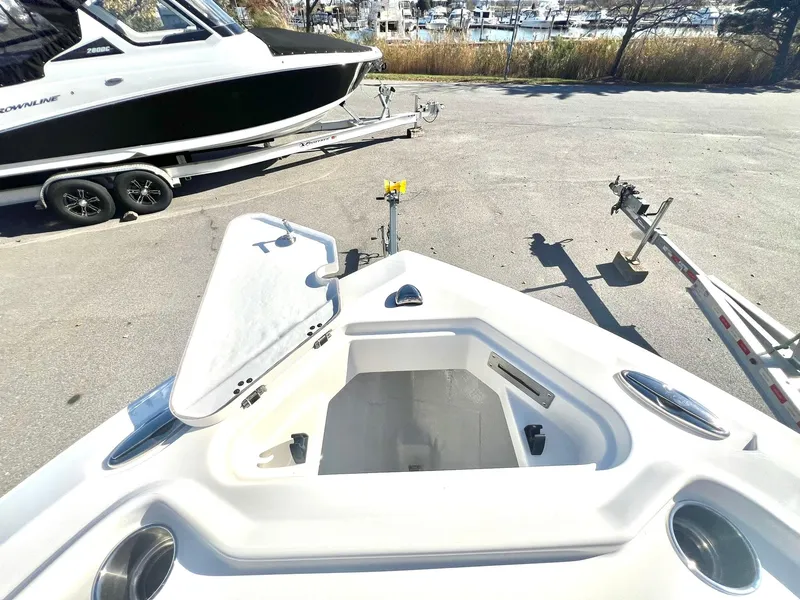 Slide: The Image of 2025 Sailfish 232 CC boat interior with seating and storage. - 10