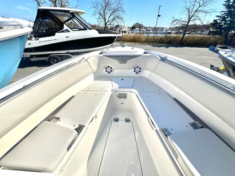 Slide: The Image of 2025 Sailfish 232 CC boat interior with spacious seating and storage compartments. - 13