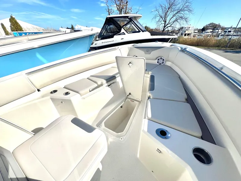 Slide: The Image of 2025 Sailfish 232 CC boat interior with seating and storage compartments. - 16