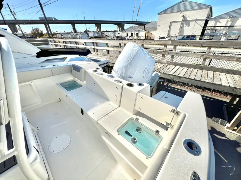 Slide: The Image of 2025 Sailfish 232 CC boat cockpit with steering wheel and controls. - 5