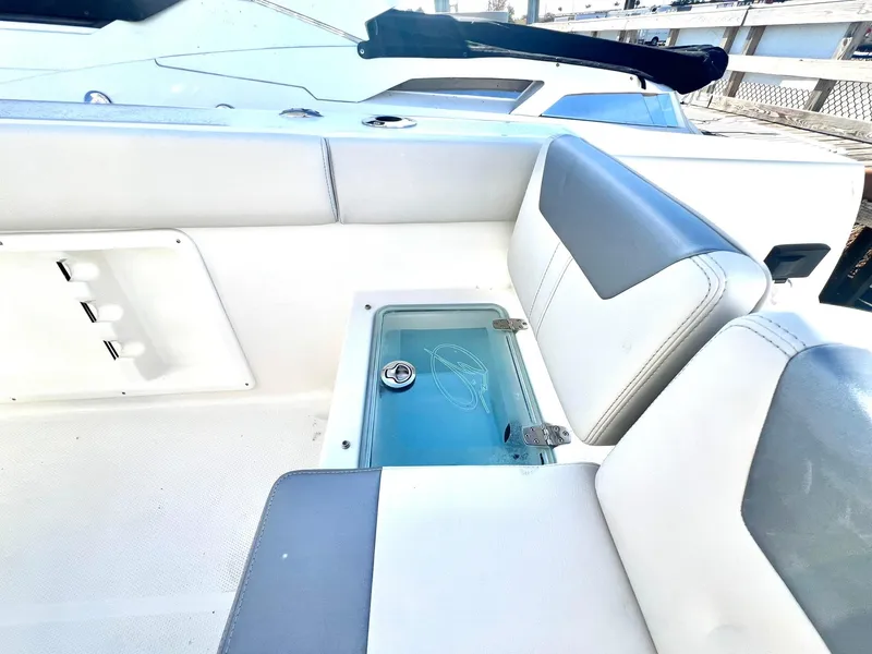 Slide: The Image of 2025 Sailfish 232 CC boat interior with open compartments and storage areas. - 6