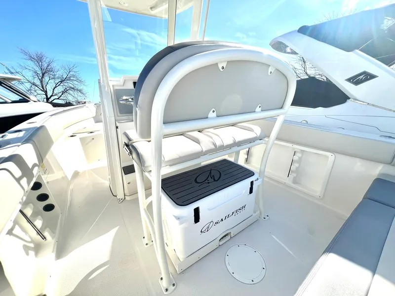 Slide: The Image of 2025 Sailfish 232 CC boat interior with seating and storage compartment. - 8