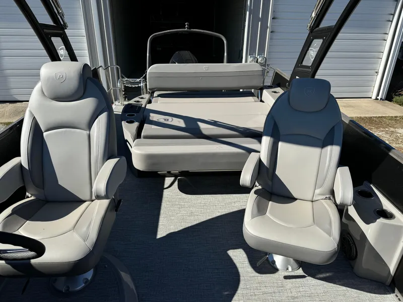 Slide: The Image of 2024 Premier 250 Sunsation boat interior with gray seating and modern design. - 15