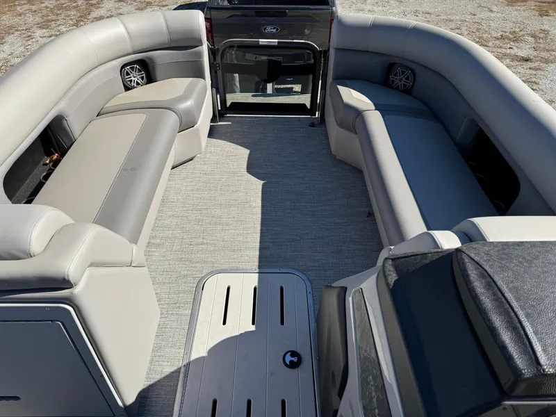 Slide: The Image of 2024 Premier 250 Sunsation pontoon boat interior with spacious seating and modern design. - 16