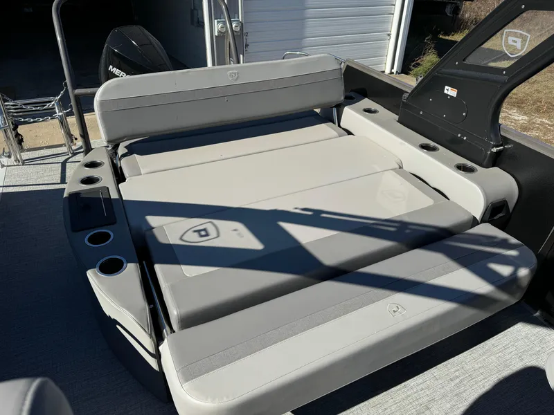 Slide: The Image of 2024 Premier 250 Sunsation boat interior with cushioned seating and cup holders. - 17