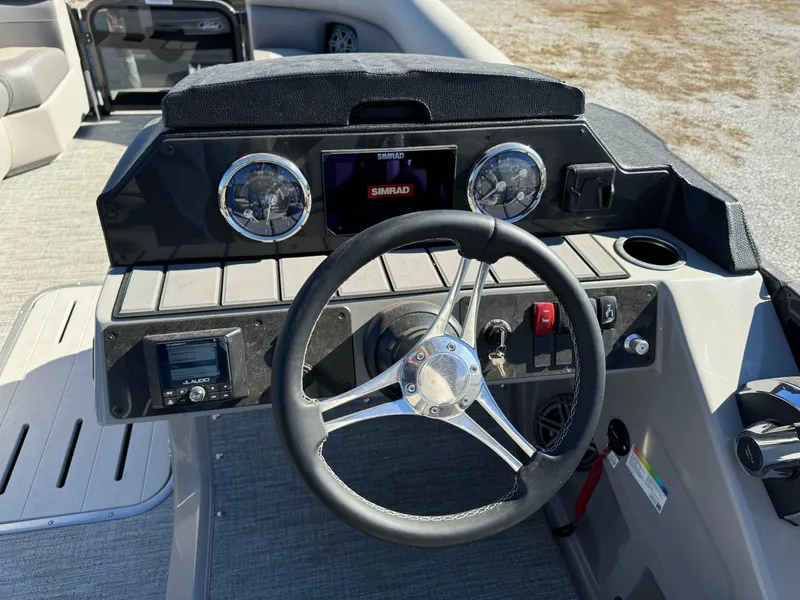 Slide: The Image of 2024 Premier 250 Sunsation boat dashboard with steering wheel and gauges. - 20