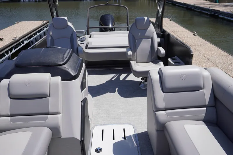 Slide: The Image of 2024 Premier 250 Sunsation pontoon boat interior with luxurious seating and modern design. - 3
