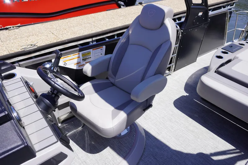 Slide: The Image of Captain's chair on 2024 Premier 250 Sunsation pontoon boat, featuring sleek design and comfortable seating. - 5