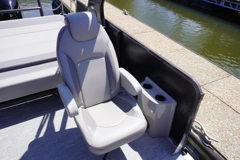 Slide: The Image of 2024 Premier 250 Sunsation boat seat with cup holders, dockside view. - 6
