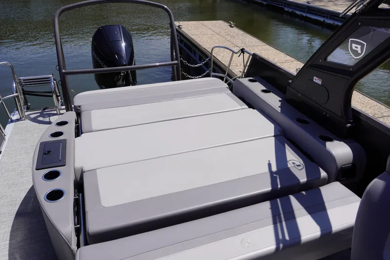 Slide: The Image of 2024 Premier 250 Sunsation boat with spacious seating and modern design at a dock. - 7