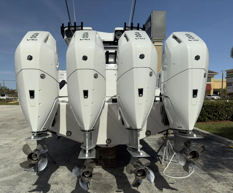 Slide: The Image of 2024 Blackfin 400 CC boat with four powerful outboard engines, rear view. - 21