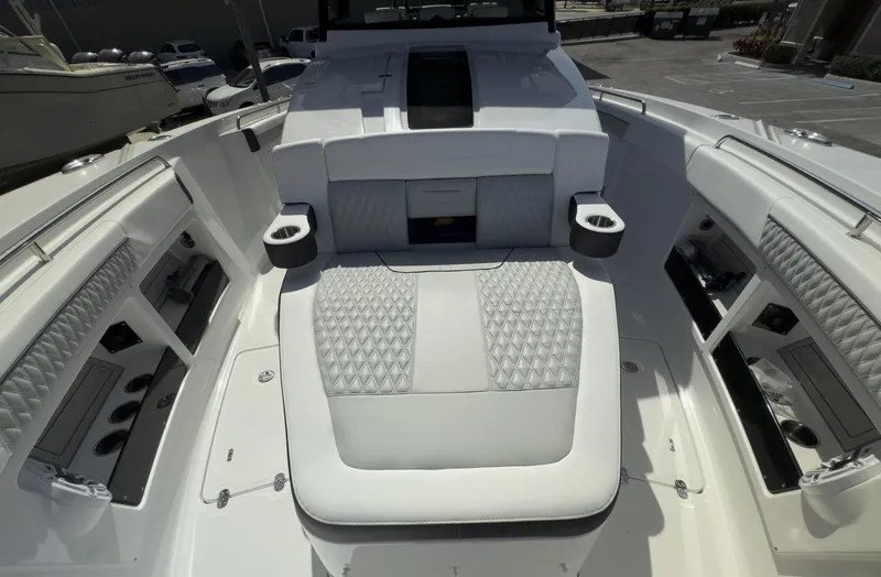 Slide: The Image of 2024 Blackfin 400 CC boat interior with luxurious seating and storage compartments. - 30