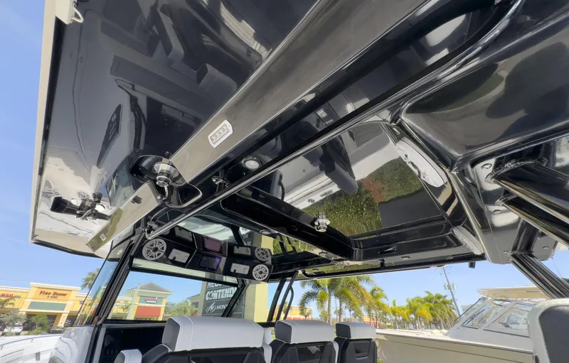 Slide: The Image of 2024 Blackfin 400 CC boat interior with sleek black roof and modern seating. - 39