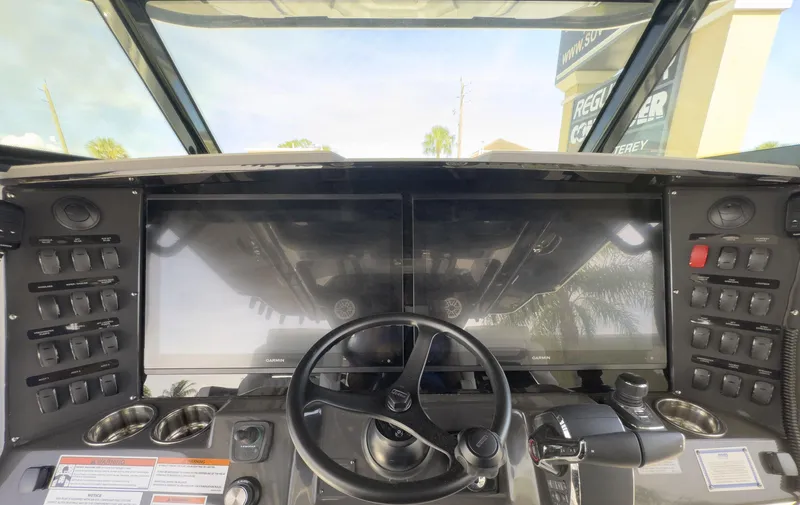 Slide: The Image of 2024 Blackfin 400 CC boat dashboard with dual screens and control panel. - 49