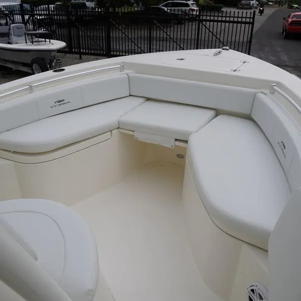 Slide: The Image of 2025 Cobia 220 Center Console boat with spacious seating area. - 4