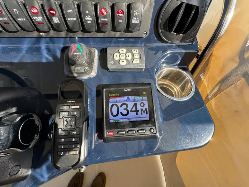 Slide: The Image of Control panel of a 2019 Pursuit S 368 Sport boat with navigation equipment. - 11