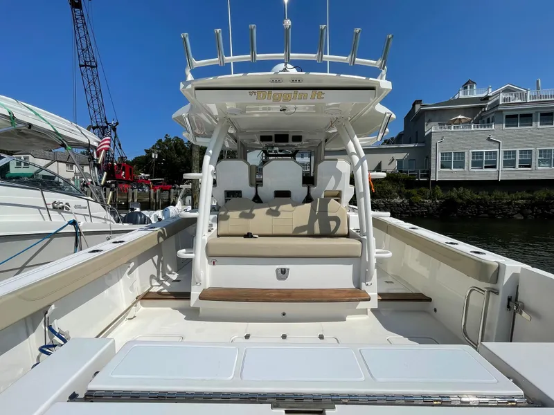 Slide: The Image of 2019 Pursuit S 368 Sport boat docked, featuring spacious seating and modern design. - 25