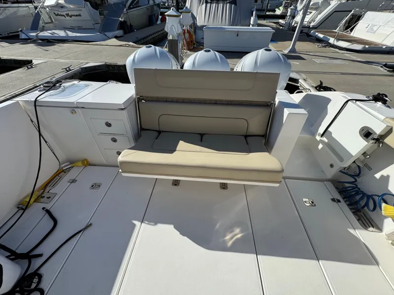 Slide: The Image of 2019 Pursuit S 368 Sport boat interior with foldable seating and storage compartments. - 4