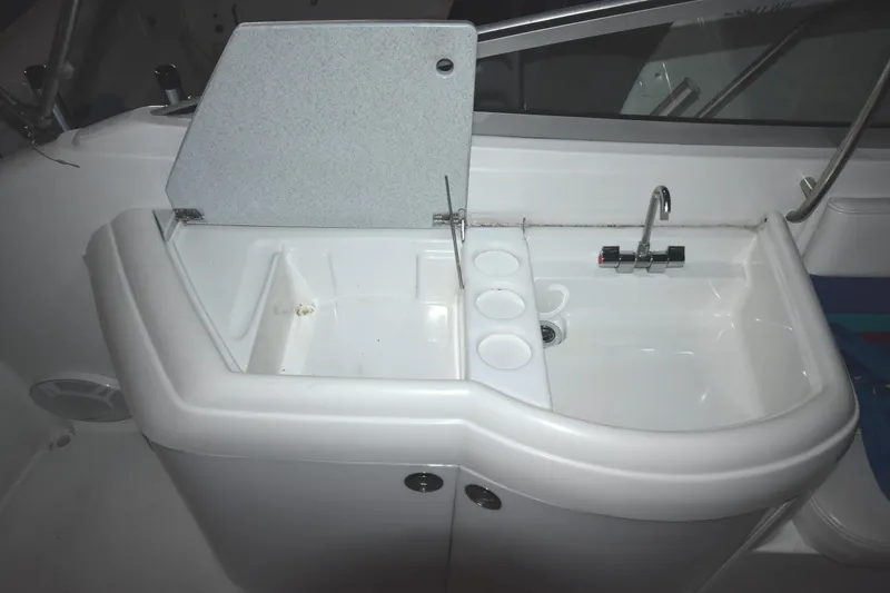 Slide: The Image of 1997 Formula 330 Sun Sport boat sink and countertop area. - 15