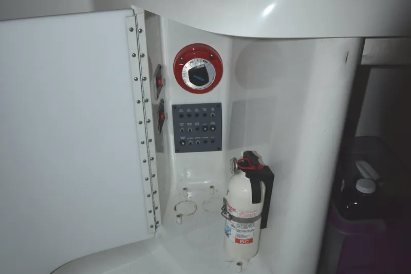 Slide: The Image of Control panel and fire extinguisher on 1997 Formula 330 Sun Sport boat. - 17