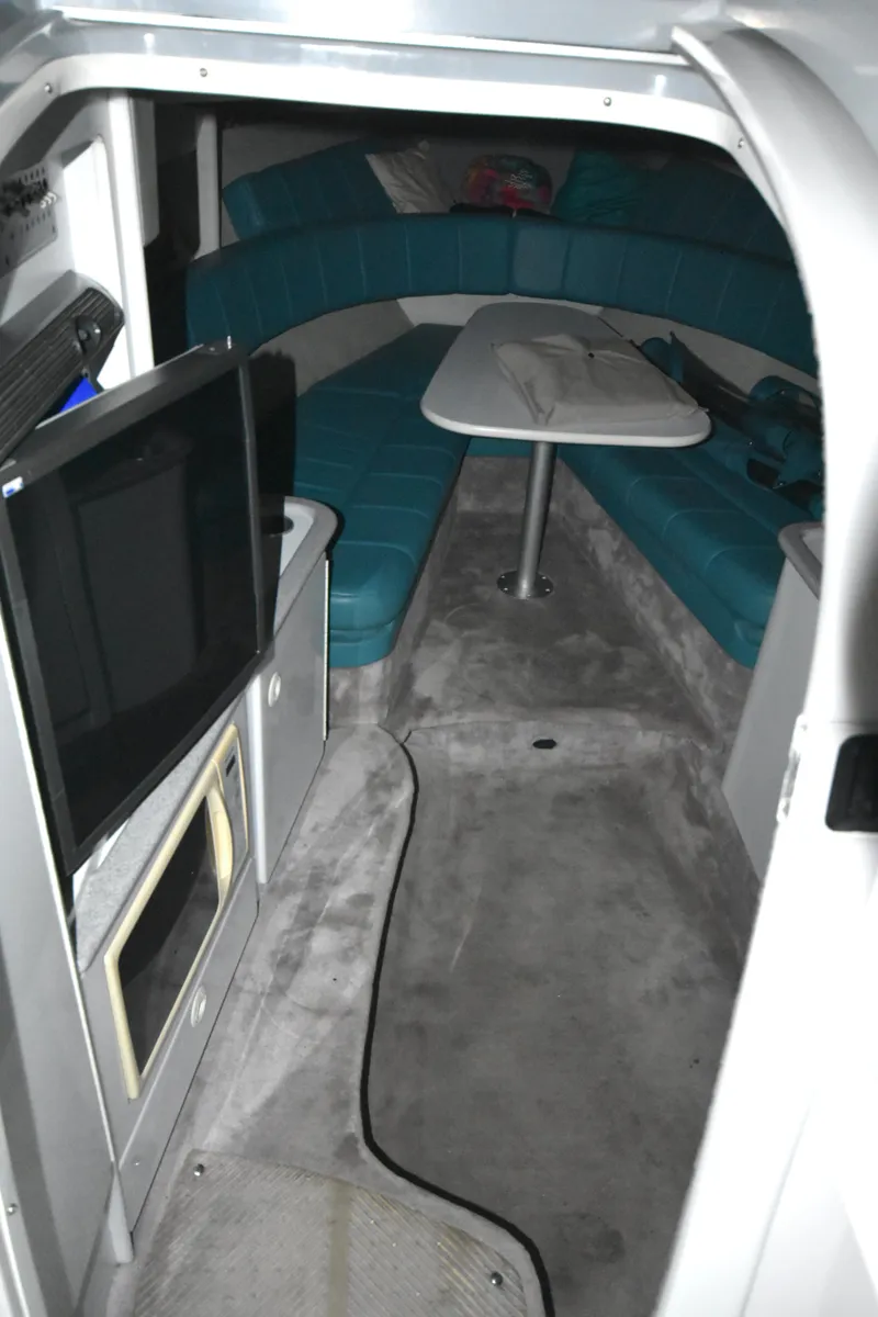 Slide: The Image of Interior of 1997 Formula 330 Sun Sport boat with seating and TV. - 31
