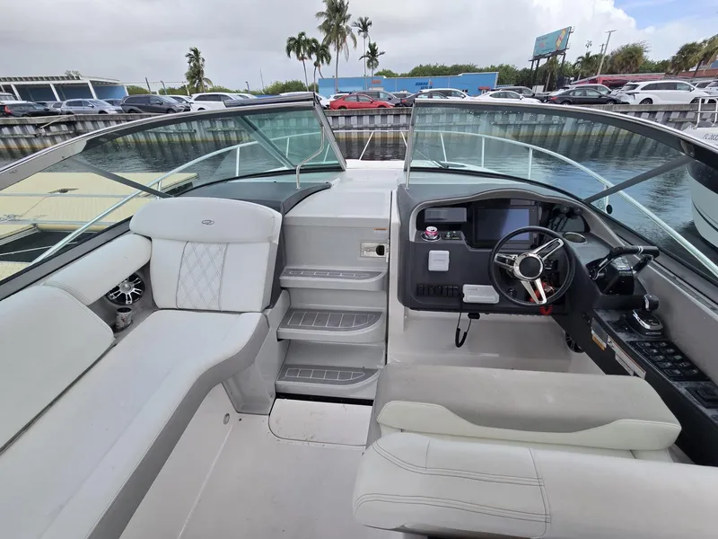 Slide: The Image of 2020 Regal 33 XO boat interior with helm, seating, and dashboard. - 3