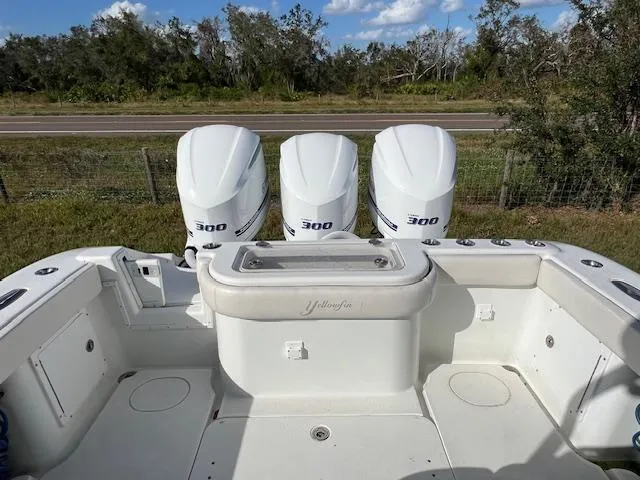 Slide: The Image of 2010 Yellowfin 36 boat with triple 300 horsepower engines, parked outdoors. - 6