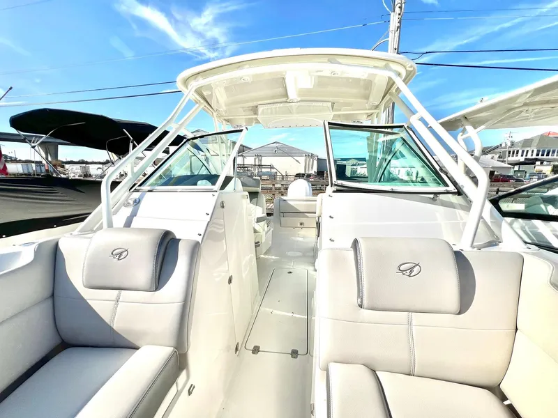 Slide: The Image of 2025 Sailfish 245 DC boat interior with plush seating and modern design. - 23