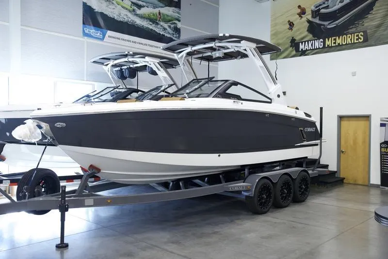 Slide: The Image of 2025 Cobalt R6 Surf boat on trailer in showroom. - 3