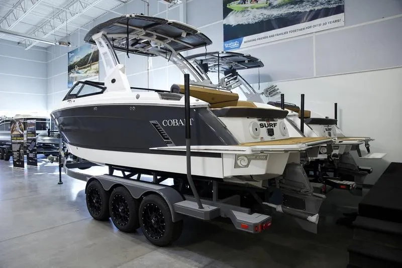 Slide: The Image of 2025 Cobalt R6 Surf boat on trailer in showroom. - 4