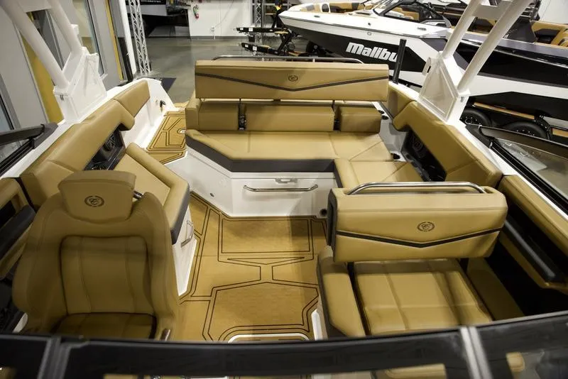 Slide: The Image of Luxurious interior of 2025 Cobalt R4 Surf boat with tan leather seating. - 15