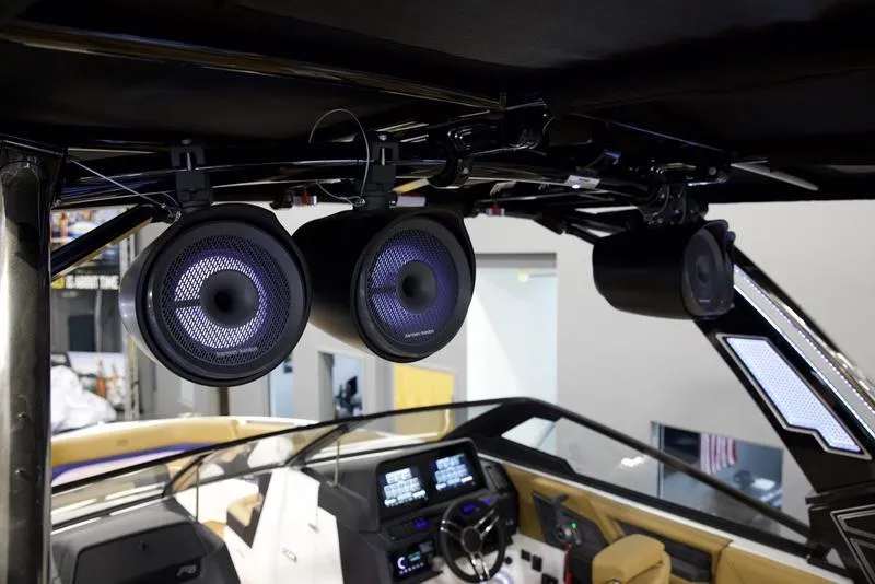 Slide: The Image of 2025 Cobalt R8 Surf boat interior with advanced audio system and modern dashboard. - 10