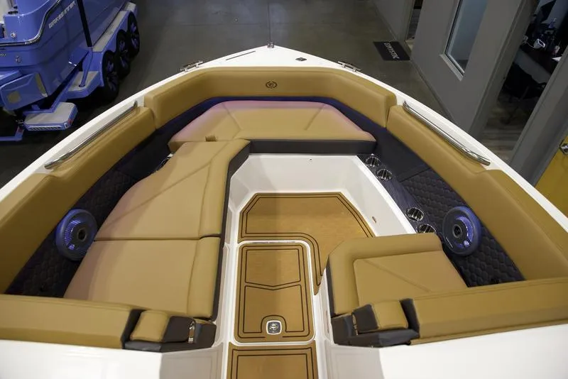 Slide: The Image of 2025 Cobalt R8 Surf boat interior with tan seating and modern design. - 14