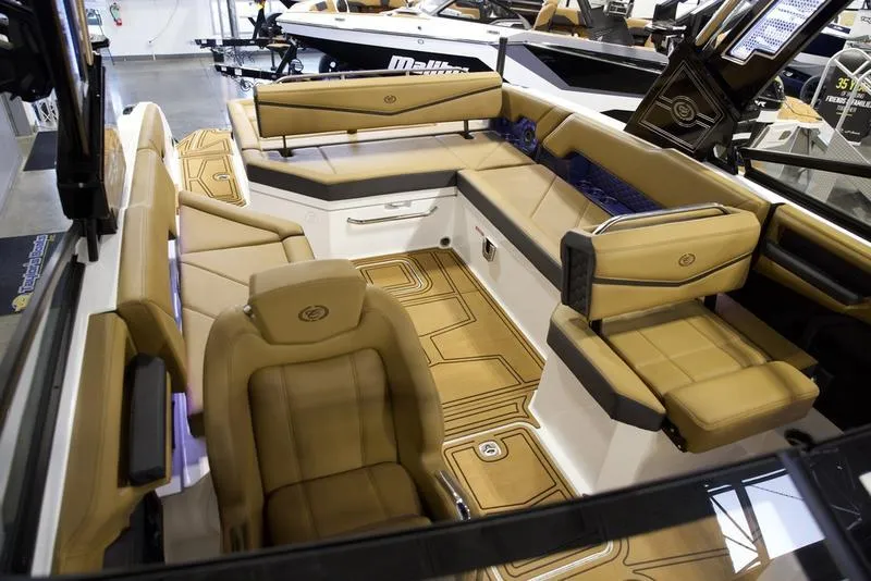 Slide: The Image of Luxurious interior of 2025 Cobalt R8 Surf boat with tan seating and modern design. - 15