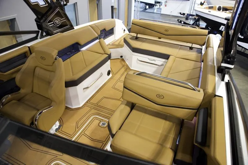 Slide: The Image of Luxurious interior of 2025 Cobalt R8 Surf boat with tan leather seating. - 17