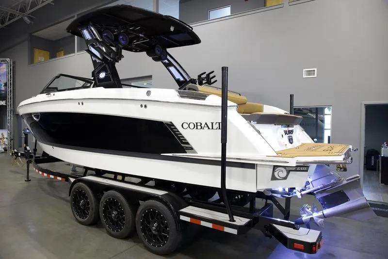 Slide: The Image of 2025 Cobalt R8 Surf boat on trailer in showroom. - 3
