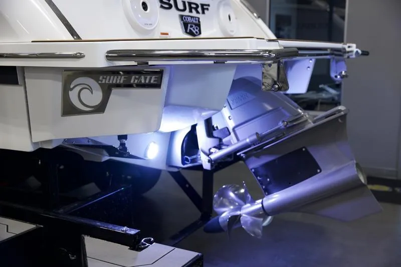 Slide: The Image of 2025 Cobalt R8 Surf boat with illuminated propeller and Surf Gate technology. - 4