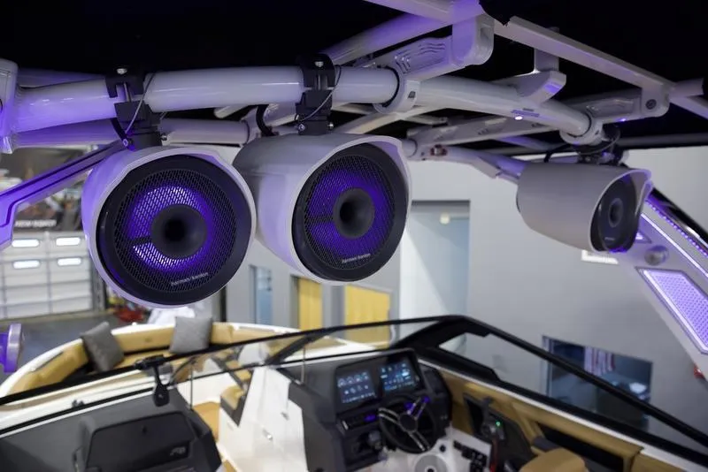 Slide: The Image of 2025 Cobalt R8 Surf boat with advanced audio system and illuminated speakers. - 11