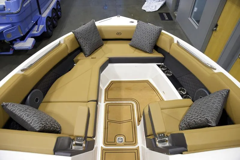 Slide: The Image of Luxurious interior of 2025 Cobalt R8 Surf boat with plush seating and cushions. - 14