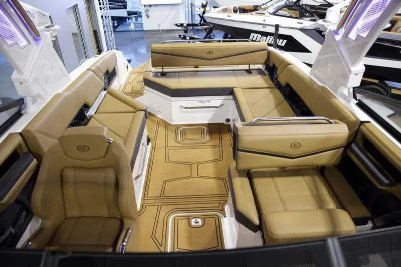 Slide: The Image of Luxurious interior of 2025 Cobalt R8 Surf boat with tan seating and modern design. - 17
