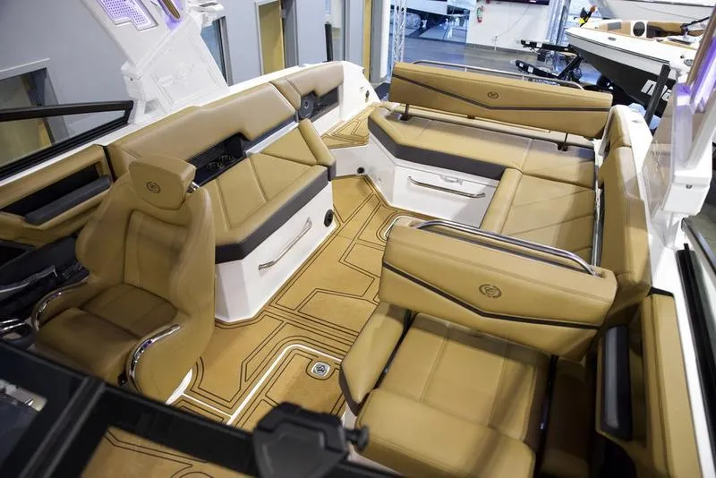 Slide: The Image of Luxurious interior of 2025 Cobalt R8 Surf boat with tan seating. - 18