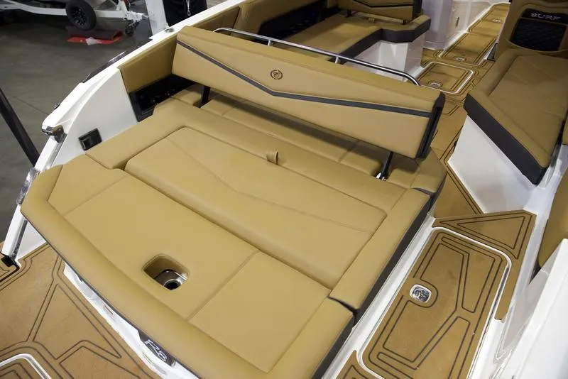 Slide: The Image of 2025 Cobalt R8 Surf boat interior with tan seating and sleek design. - 20