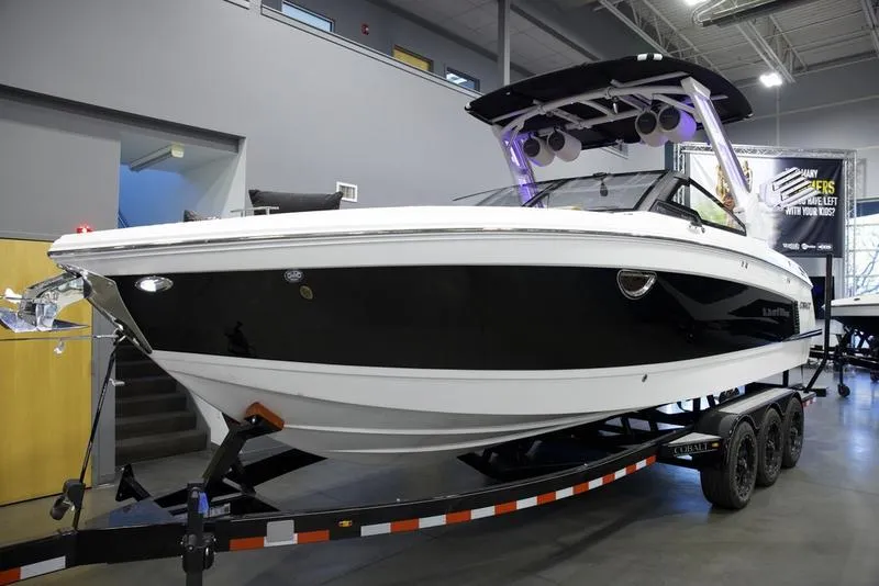 Slide: The Image of 2025 Cobalt R8 Surf boat on trailer in showroom. - 3