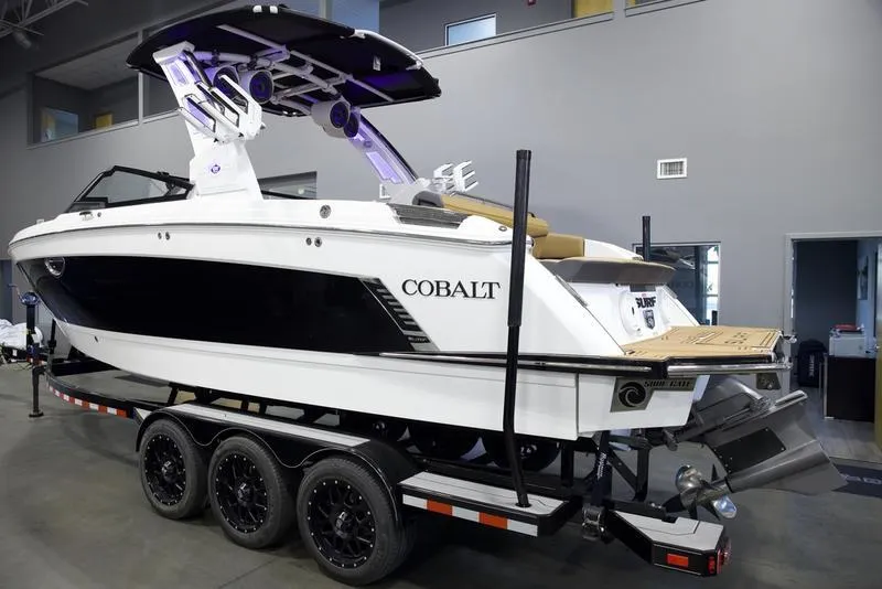 Slide: The Image of 2025 Cobalt R8 Surf boat on trailer in showroom. - 4