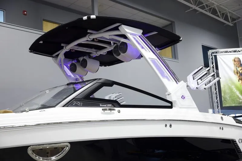 Slide: The Image of 2025 Cobalt R8 Surf boat with sleek design and advanced audio system. - 8