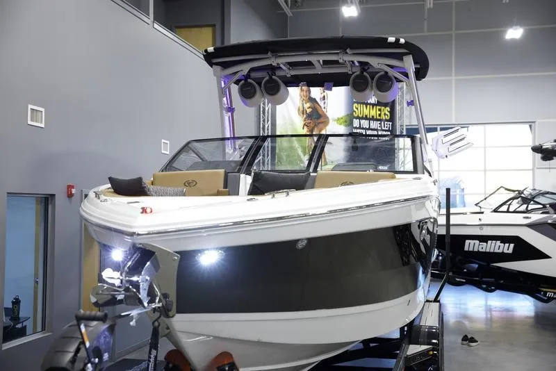 Slide: The Image of 2025 Cobalt R8 Surf boat displayed indoors with modern design and advanced features. - 9