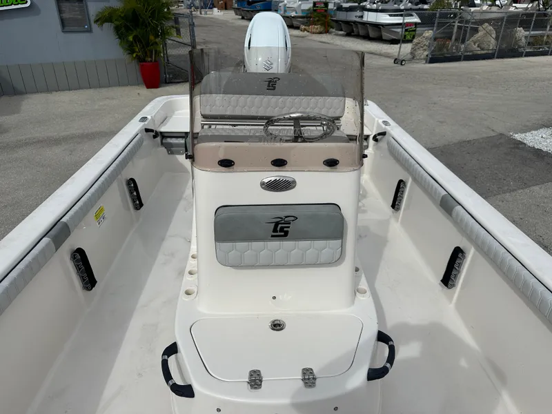 Slide: The Image of 2025 Carolina Skiff 21 LS boat interior, featuring console and seating area. - 12