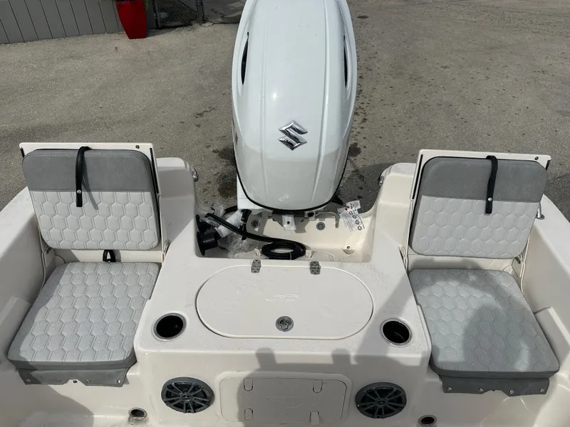 Slide: The Image of 2025 Carolina Skiff 21 LS boat interior with seating and outboard motor. - 15