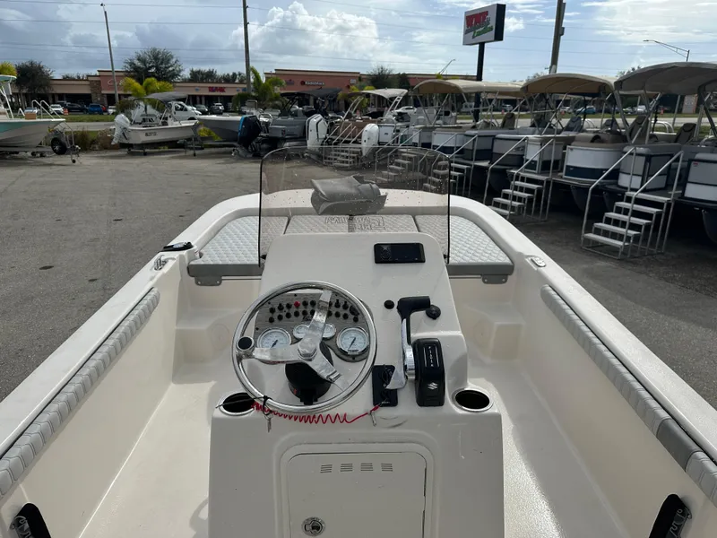 Slide: The Image of 2025 Carolina Skiff 21 LS boat interior with steering console and gauges. - 8