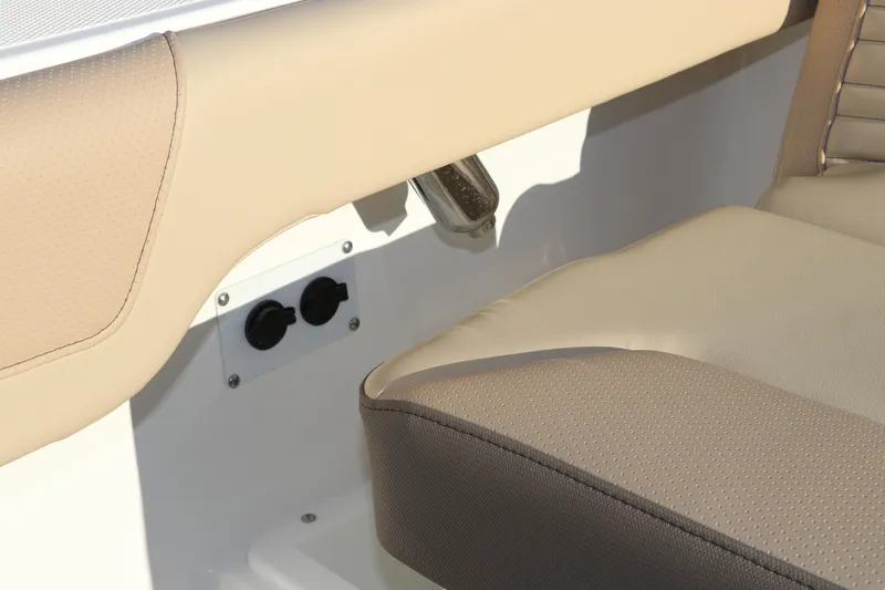 Slide: The Image of 2025 Edgewater 248 CX boat interior with rod holders and storage compartment. - 13